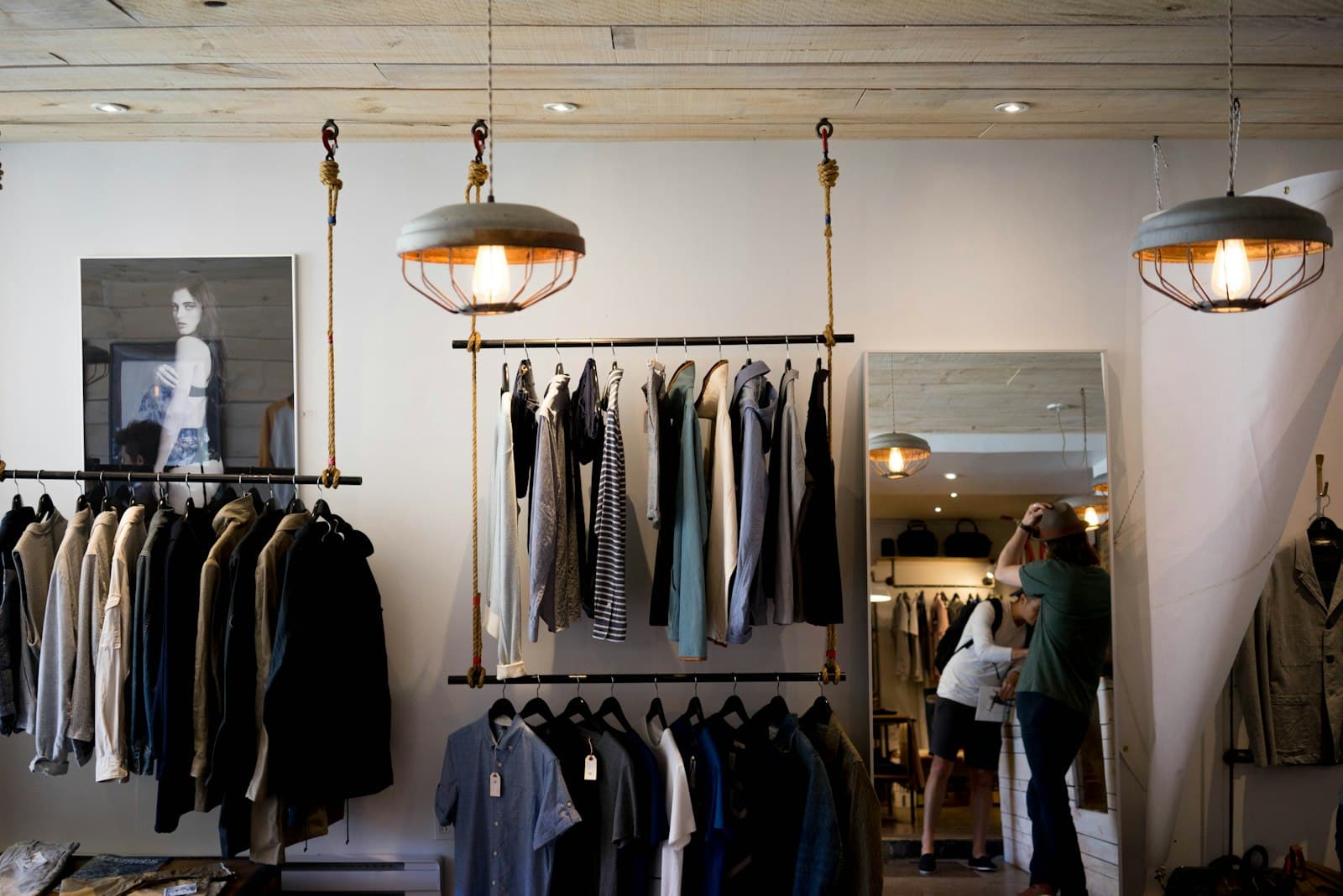 Clothing displayed on tables in a boutique