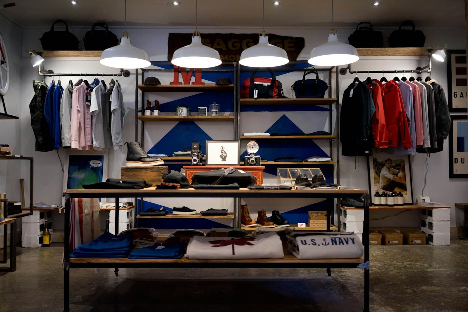 A bright retail shop floor with clothing racks